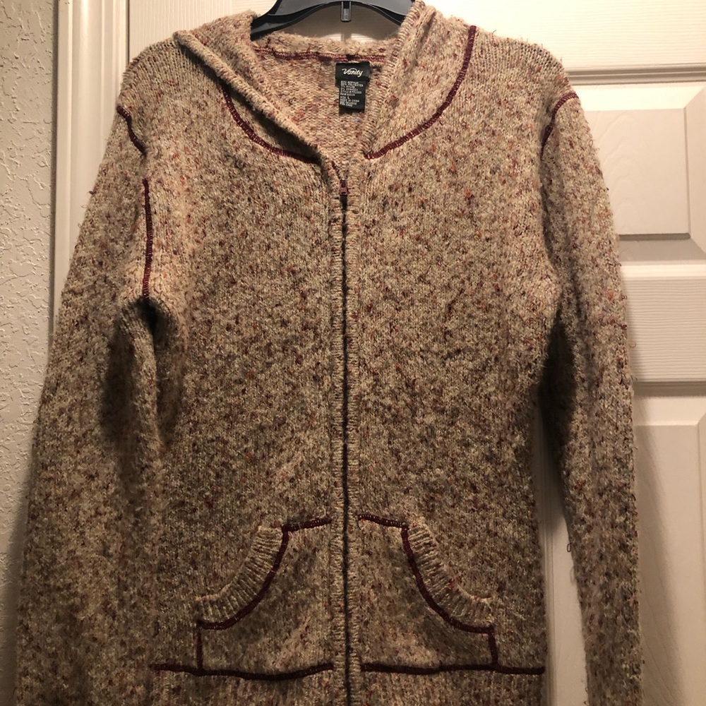 Multi Color Sweater that has a hood and zips with cute pockets. Great Condition
